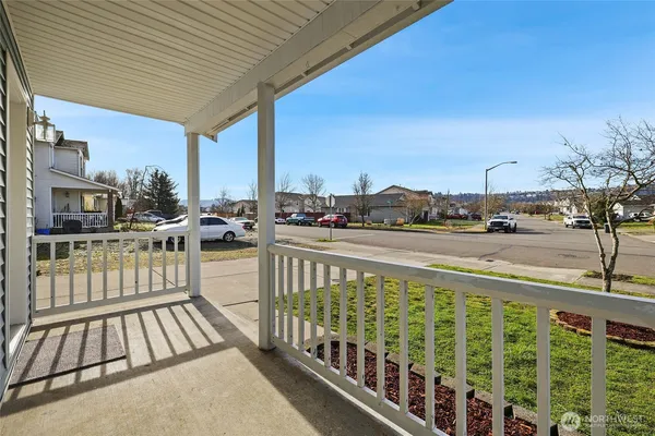 a view of balcony with wooden floor