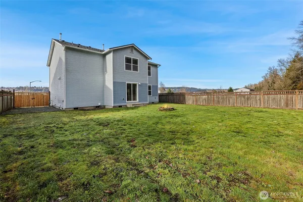 a view of a house with backyard and garden