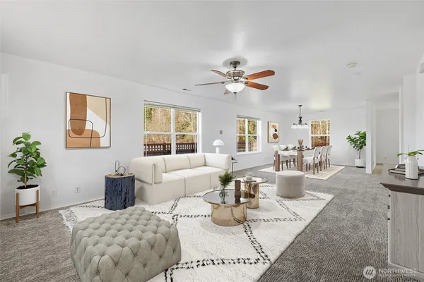a view of a dining room with furniture a chandelier and wooden floor