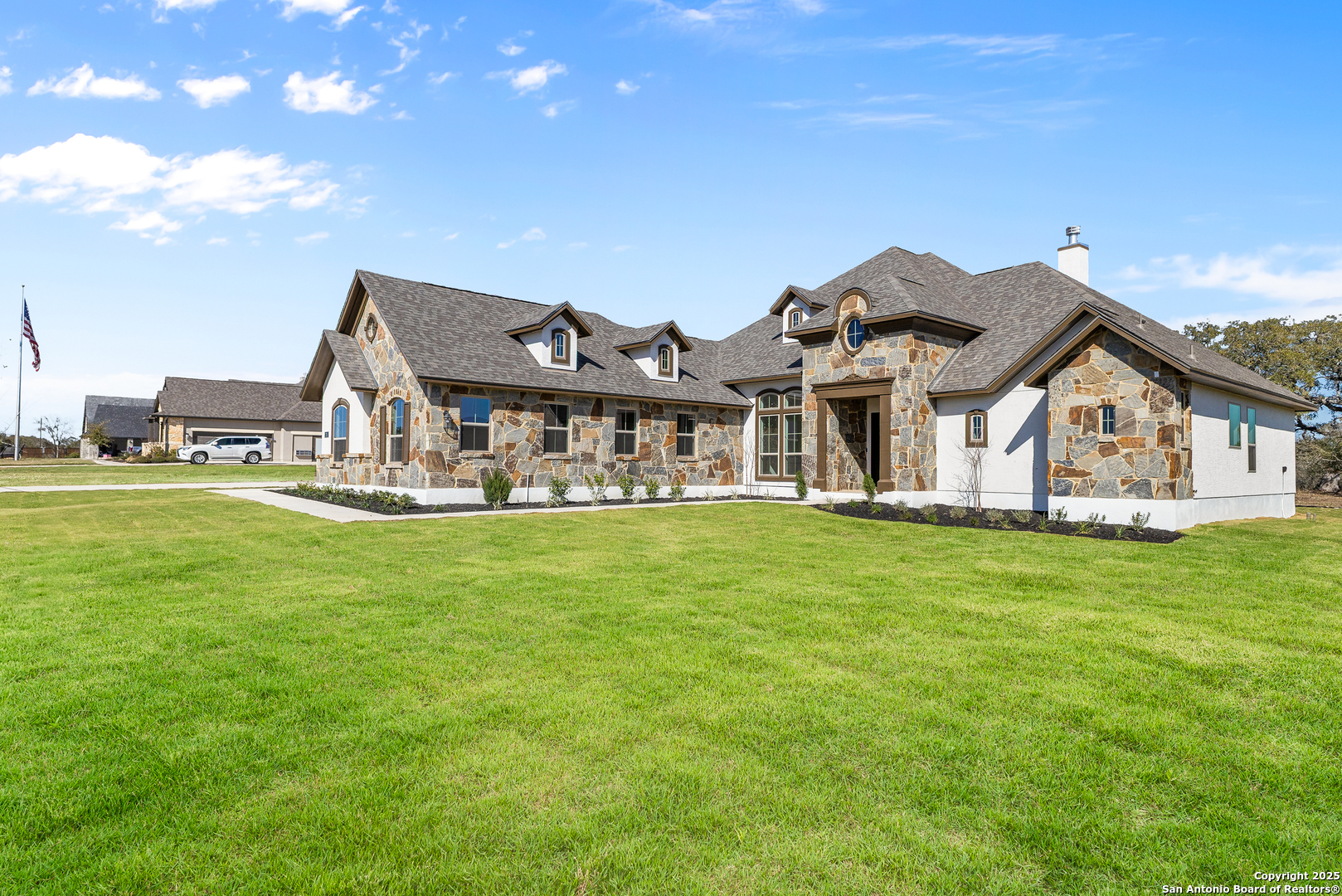 241 Stone Loop Castroville, TX 78009 - Photo 21 of 23 a front view of a house with garden
