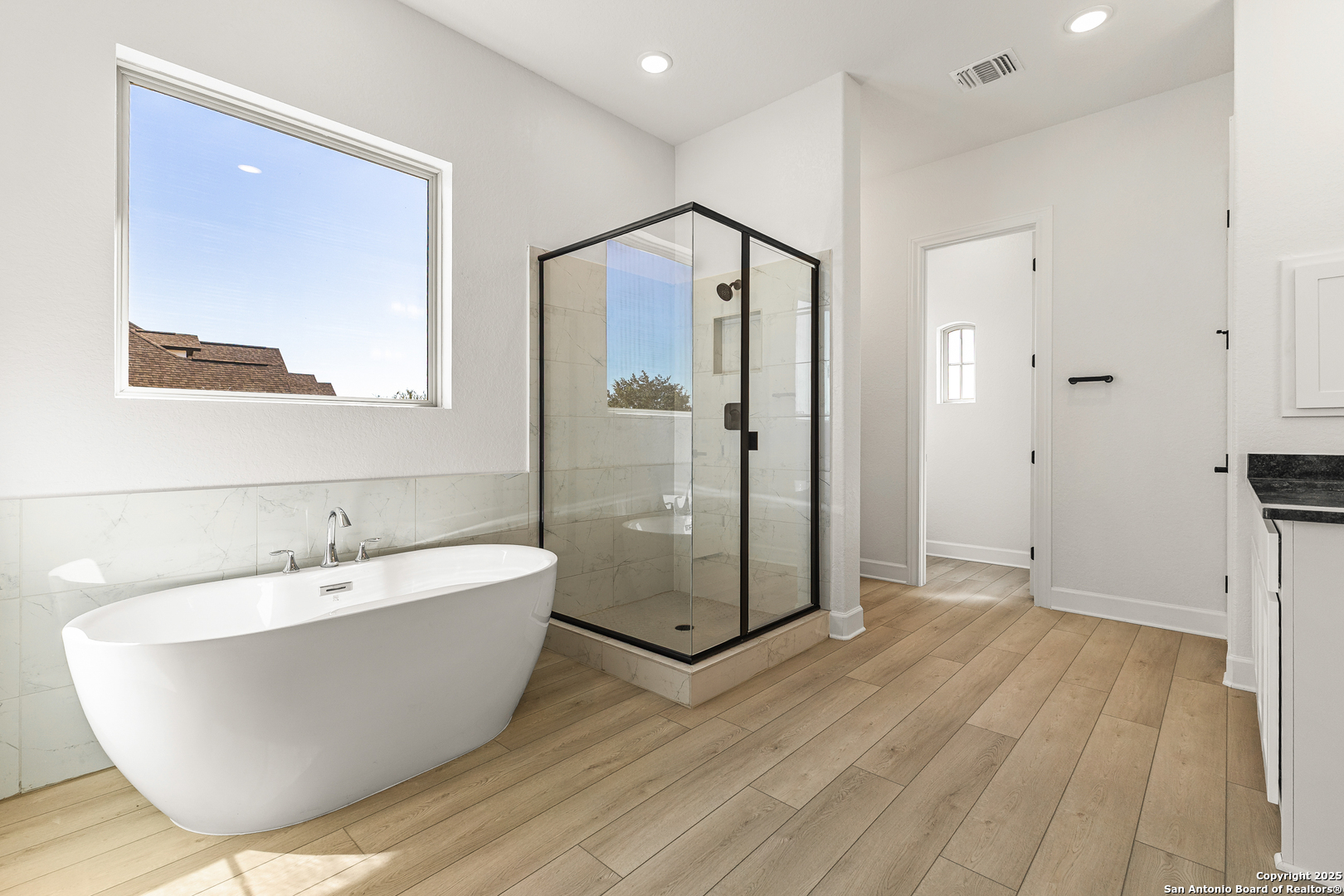 241 Stone Loop Castroville, TX 78009 - Photo 25 of 37 a spacious bathroom with a bathtub and shower