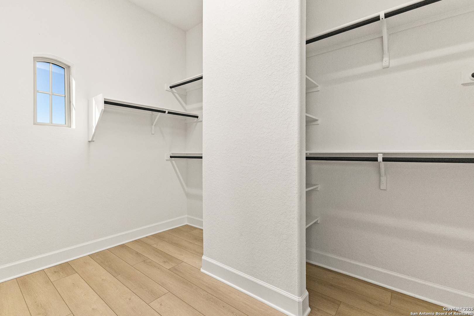 241 Stone Loop Castroville, TX 78009 - Photo 29 of 37 a bathroom with a glass shower door