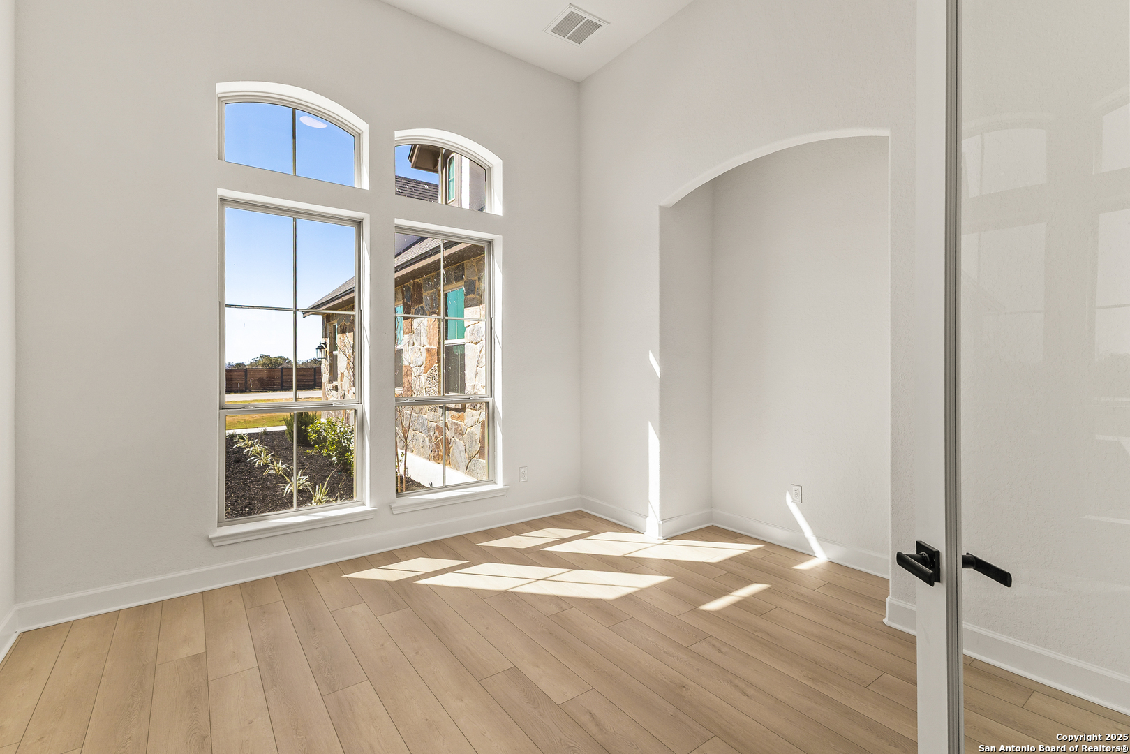 241 Stone Loop Castroville, TX 78009 - Photo 3 of 23 a view of an empty room with a window