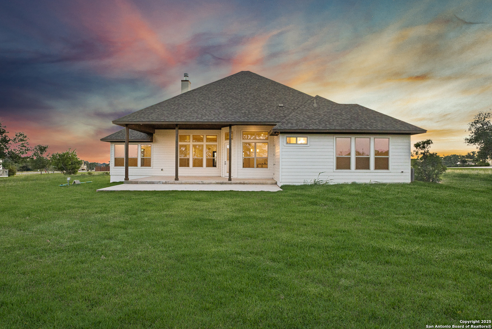 241 Stone Loop Castroville, TX 78009 - Photo 37 of 37 a front view of a house with a garden