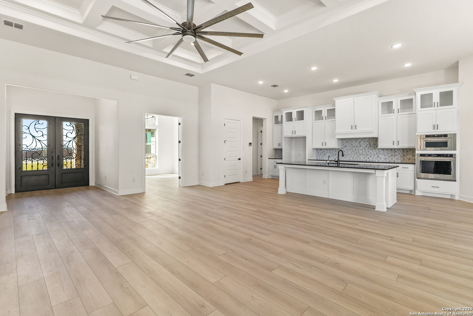 241 Stone Loop Castroville, TX 78009 - Photo 10 of 37 a view of kitchen with wooden floor and electronic appliances