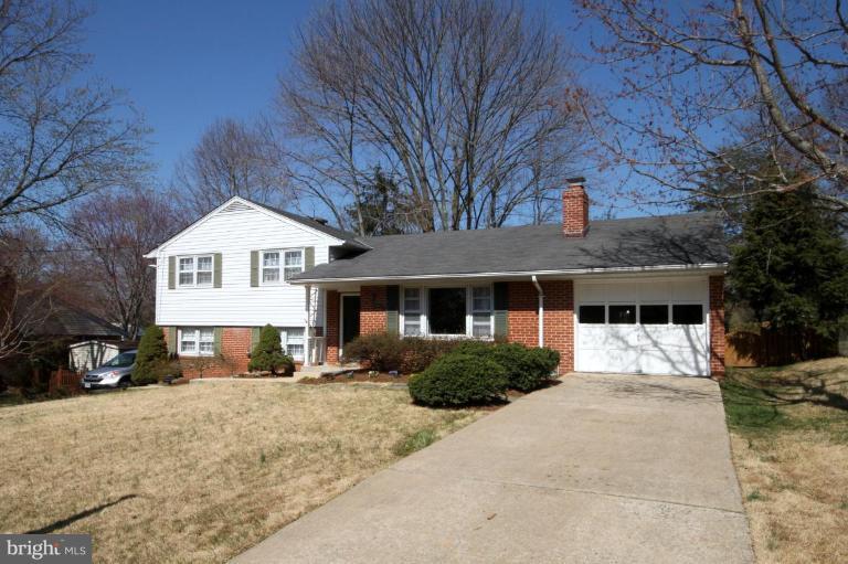 5631 Inverchapel Road Springfield, VA 22151 - Photo 1 of 30 a front view of a house with a yard and garage