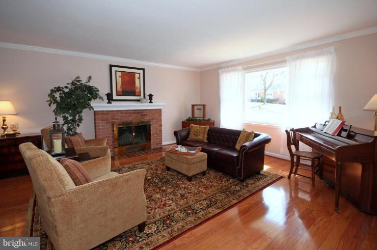 5631 Inverchapel Road Springfield, VA 22151 - Photo 2 of 30 a living room with furniture fireplace and a window