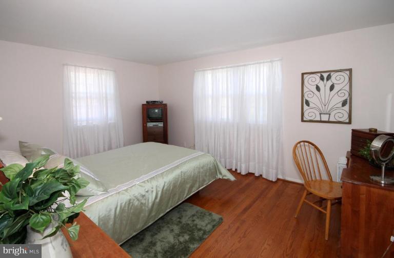 5631 Inverchapel Road Springfield, VA 22151 - Photo 15 of 30 a bedroom with a bed and a dresser