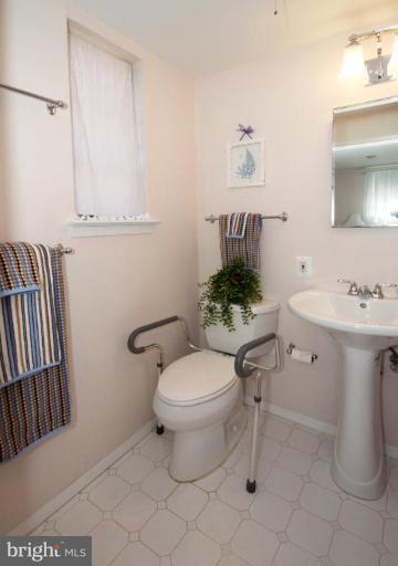 5631 Inverchapel Road Springfield, VA 22151 - Photo 16 of 30 a bathroom with a sink toilet and a mirror