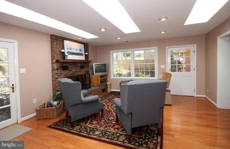 5631 Inverchapel Road Springfield, VA 22151 - Photo 20 of 30 a living room with furniture and a flat screen tv