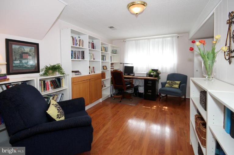 5631 Inverchapel Road Springfield, VA 22151 - Photo 24 of 30 a living room with furniture and a wooden floor