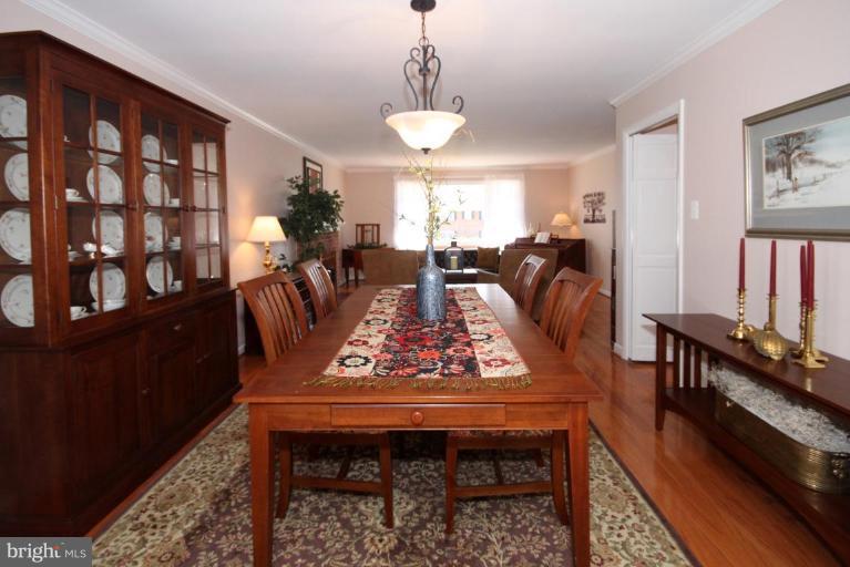 5631 Inverchapel Road Springfield, VA 22151 - Photo 6 of 30 a view of a dining room with furniture window and wooden floor