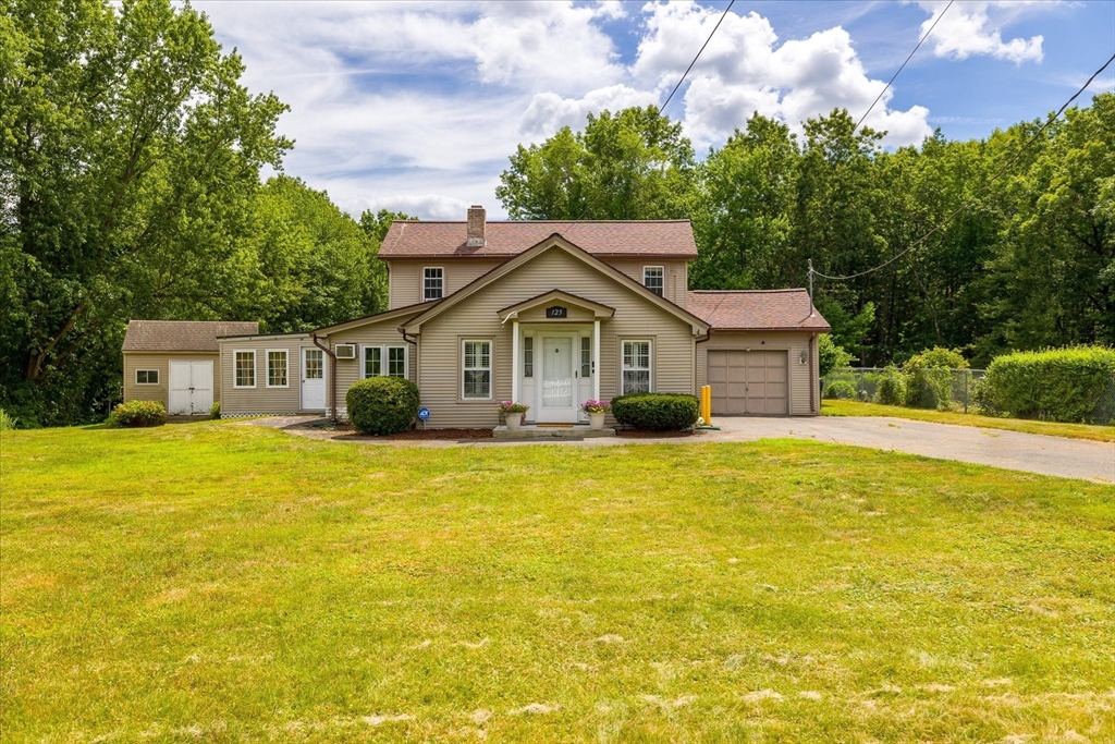a front view of a house with a yard