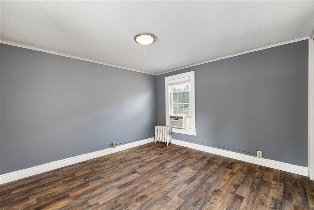 125 Fair Oak Road Springfield, MA 01128 - Photo 20 of 29 a view of empty room with wooden floor and fan