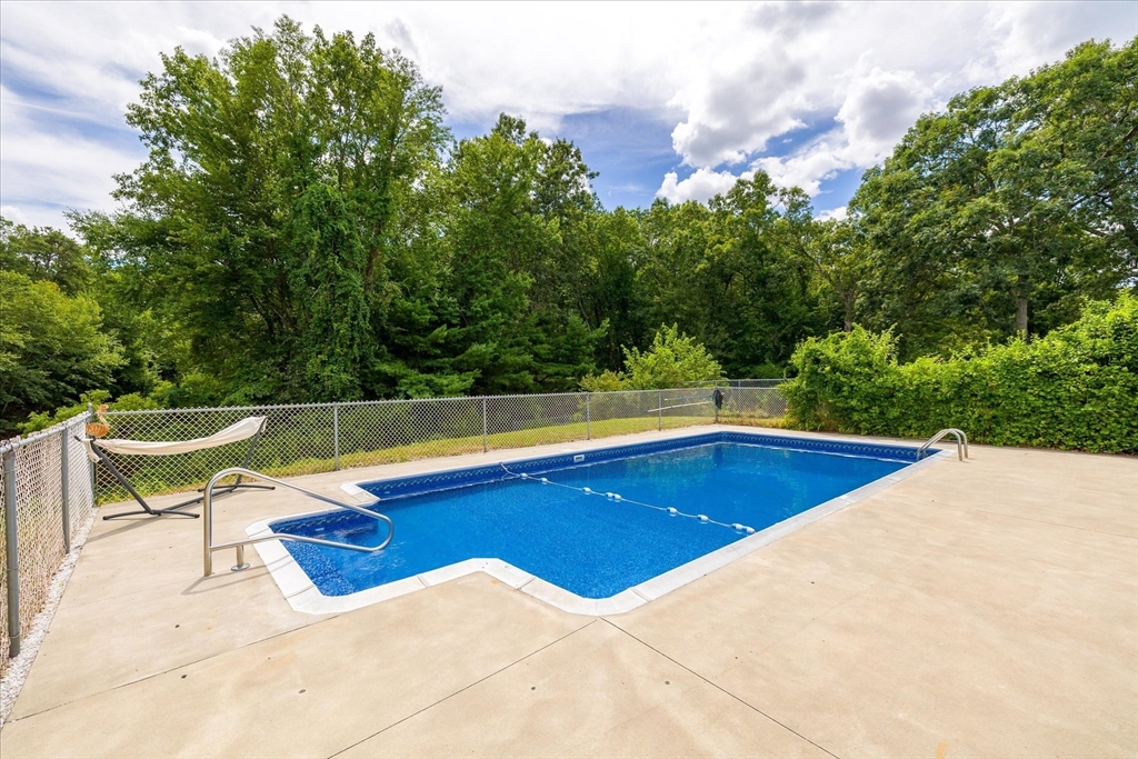 125 Fair Oak Road Springfield, MA 01128 - Photo 26 of 29 a view of swimming pool with a yard and sitting area