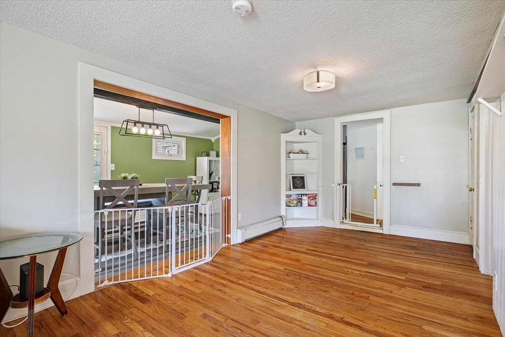 125 Fair Oak Road Springfield, MA 01128 - Photo 7 of 29 a bedroom with a bed and wooden floor
