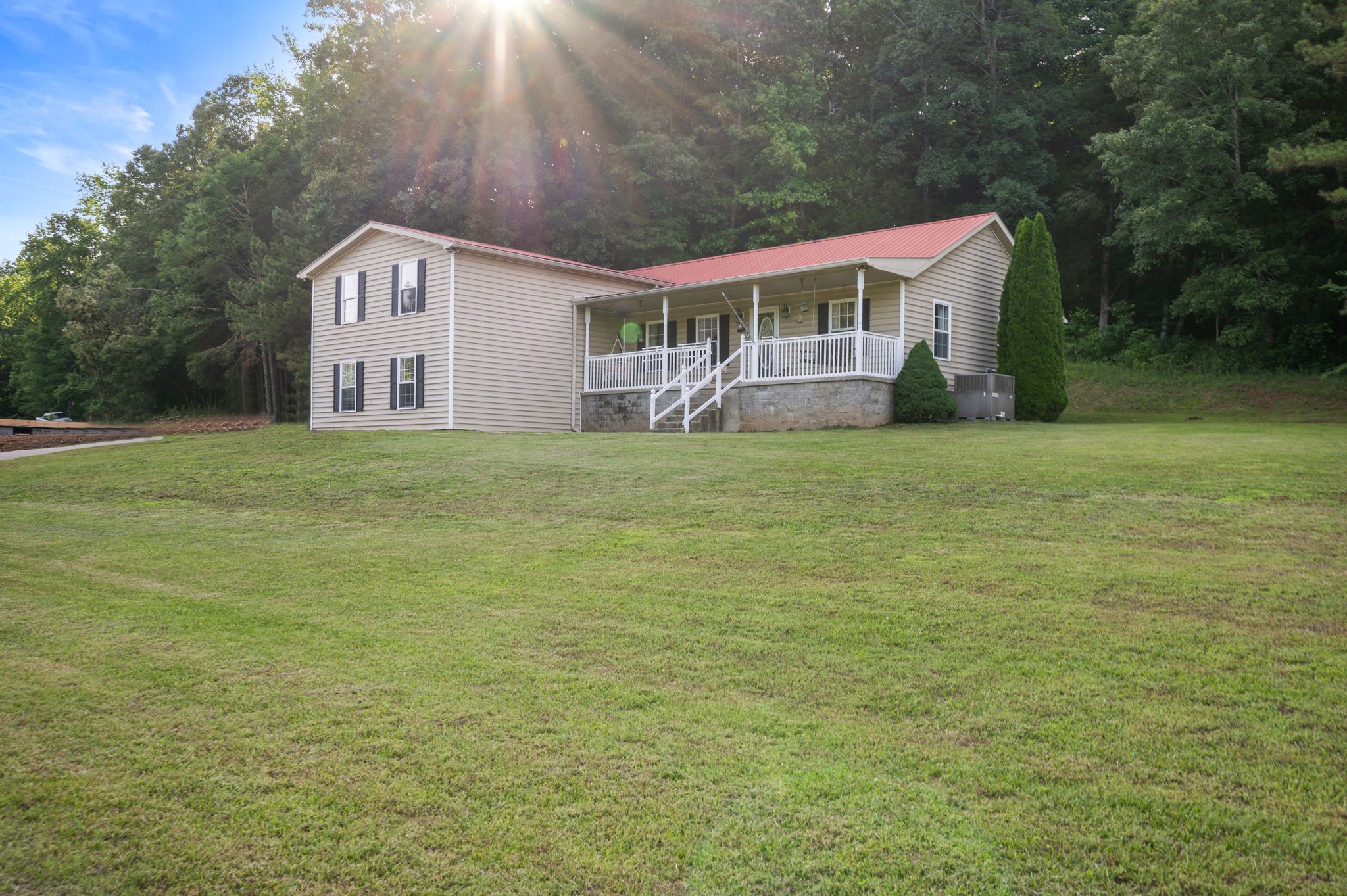 1197 Biter Road Cunningham, TN 37052 - Photo 30 of 38 a house with view of a big yard next to a building