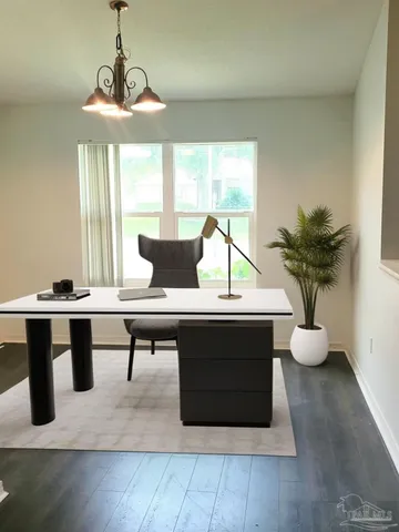 a living room with furniture and window