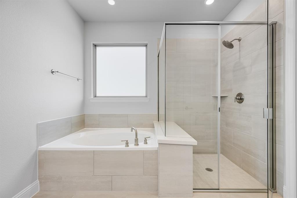 522 Bull Street Oak Point, TX 75068 - Photo 12 of 36 a white bath tub sitting next to a shower