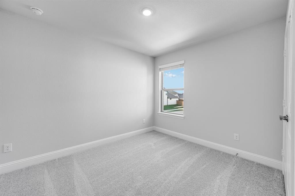 522 Bull Street Oak Point, TX 75068 - Photo 16 of 36 an empty room with a window