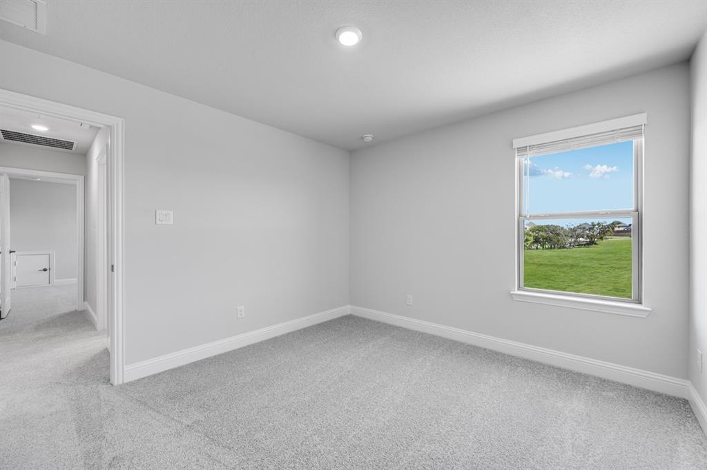 522 Bull Street Oak Point, TX 75068 - Photo 17 of 36 an empty room with windows