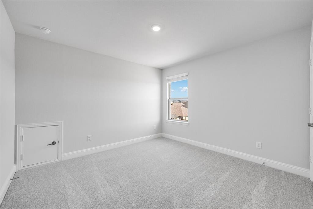 522 Bull Street Oak Point, TX 75068 - Photo 19 of 36 an empty room with a window