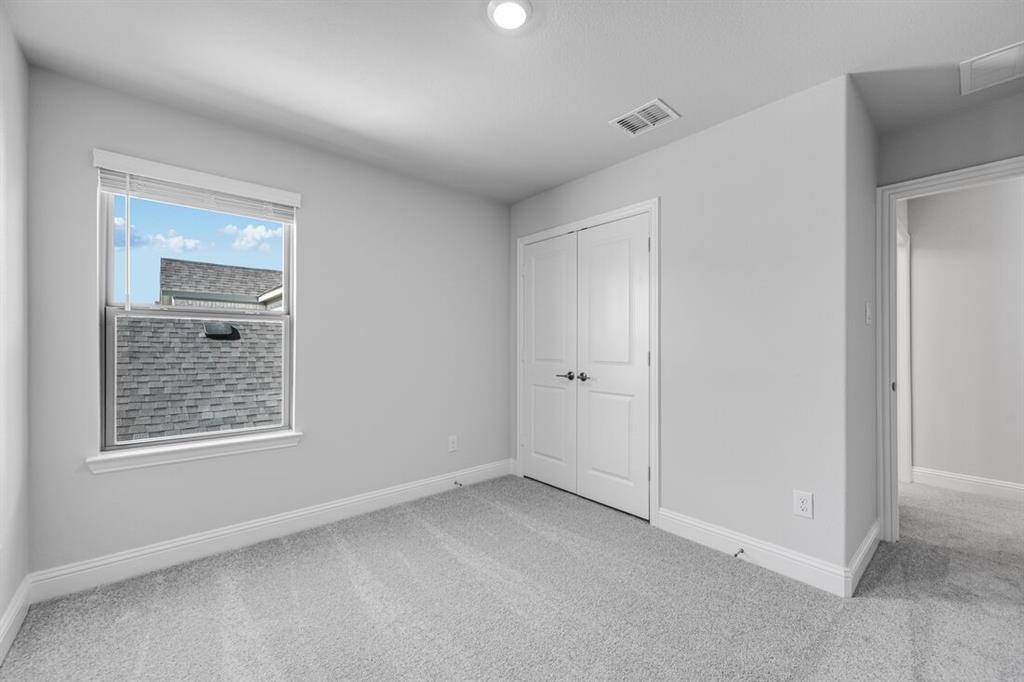 522 Bull Street Oak Point, TX 75068 - Photo 20 of 36 a view of an empty room with closet and a window