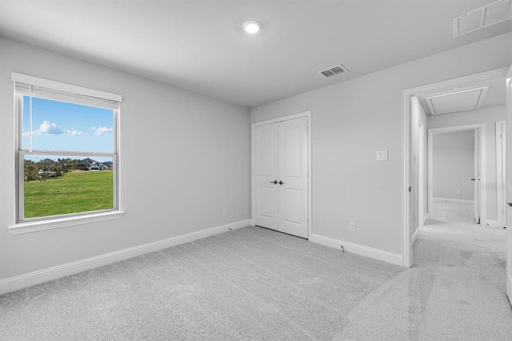 522 Bull Street Oak Point, TX 75068 - Photo 21 of 36 an empty room with a window