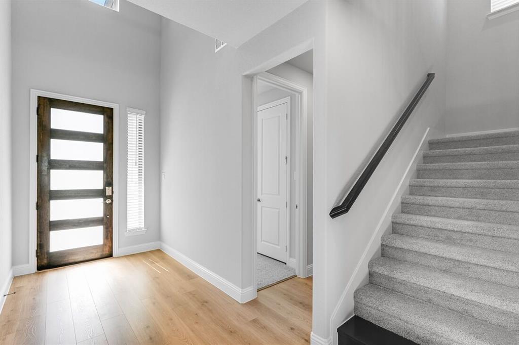 522 Bull Street Oak Point, TX 75068 - Photo 26 of 36 a view of an entryway with wooden floor and stairs