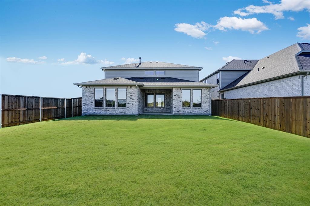 522 Bull Street Oak Point, TX 75068 - Photo 29 of 36 a view of a house with a backyard