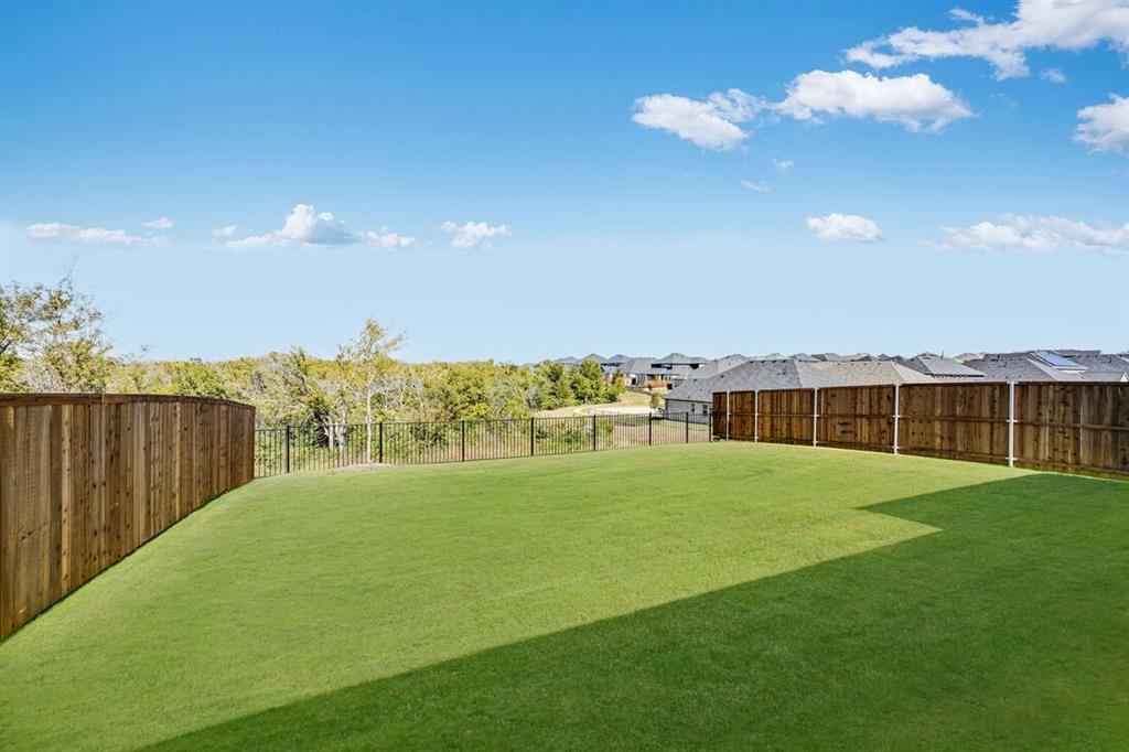 522 Bull Street Oak Point, TX 75068 - Photo 30 of 36 a view of building with ocean view