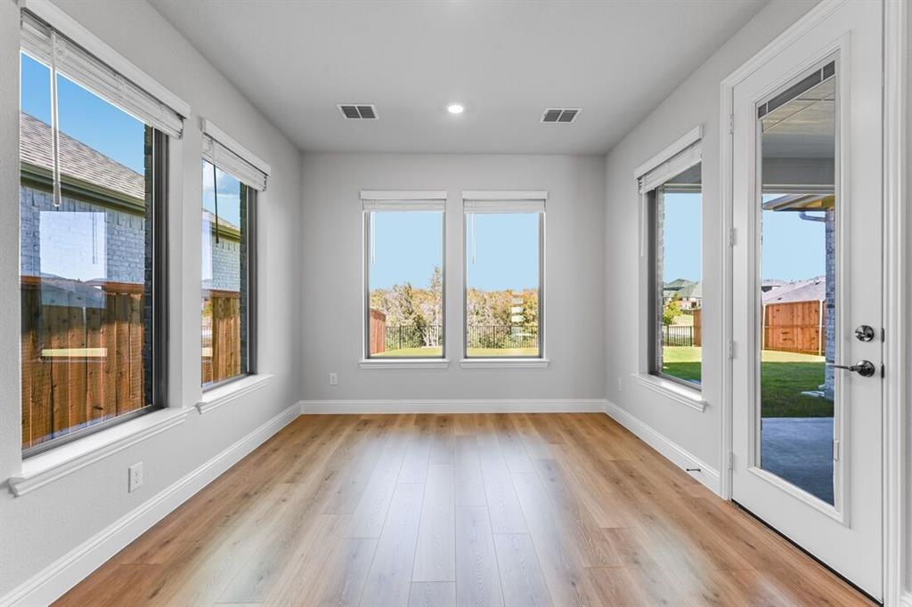 522 Bull Street Oak Point, TX 75068 - Photo 8 of 36 a view of an entryway with wooden floor and door