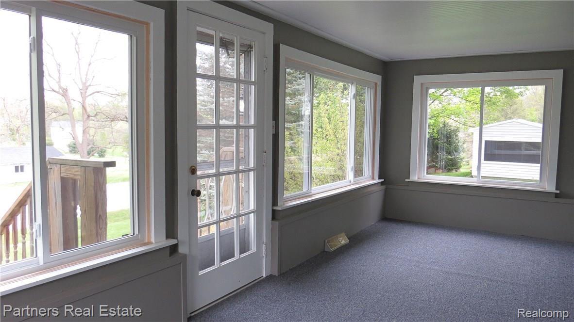 4524 Pinckney Road Howell, MI 48843 - Photo 20 of 58 13.Large front enclosed porch on front of 4524 Pinckney Rd
