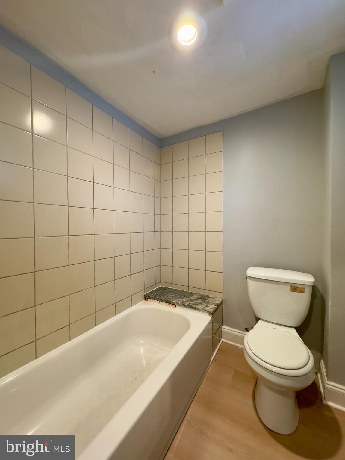 408 South Conkling Street, Unit 1 Baltimore, MD 21224 - Photo 11 of 14 a bathroom with a toilet and shower