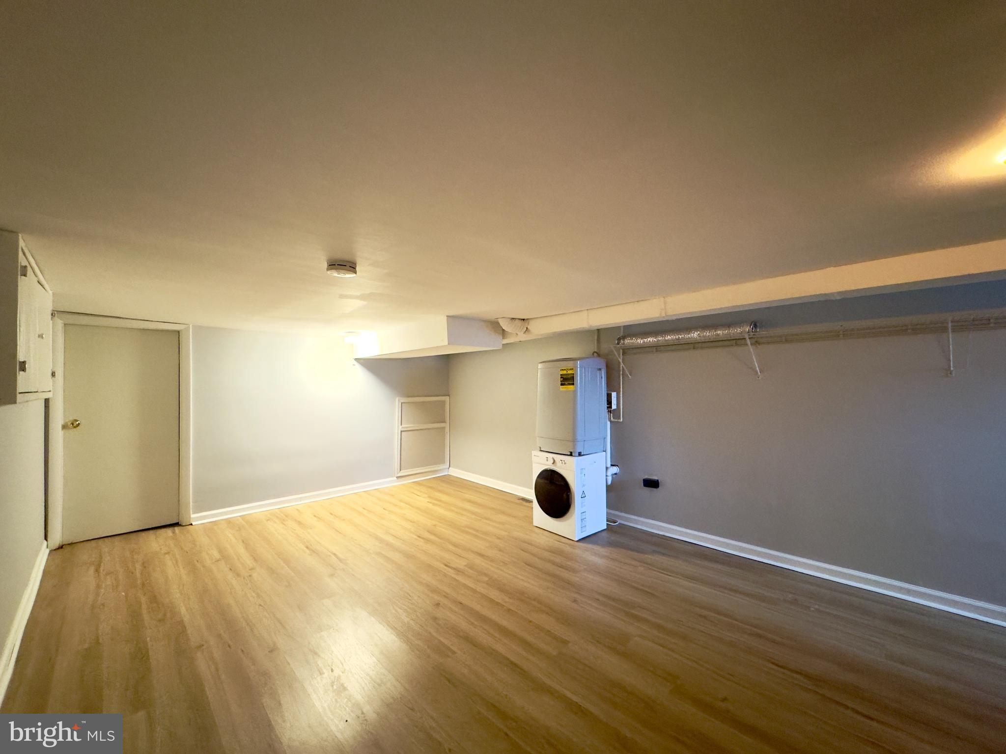 408 South Conkling Street, Unit 1 Baltimore, MD 21224 - Photo 13 of 14 a view of an empty room and wooden floor