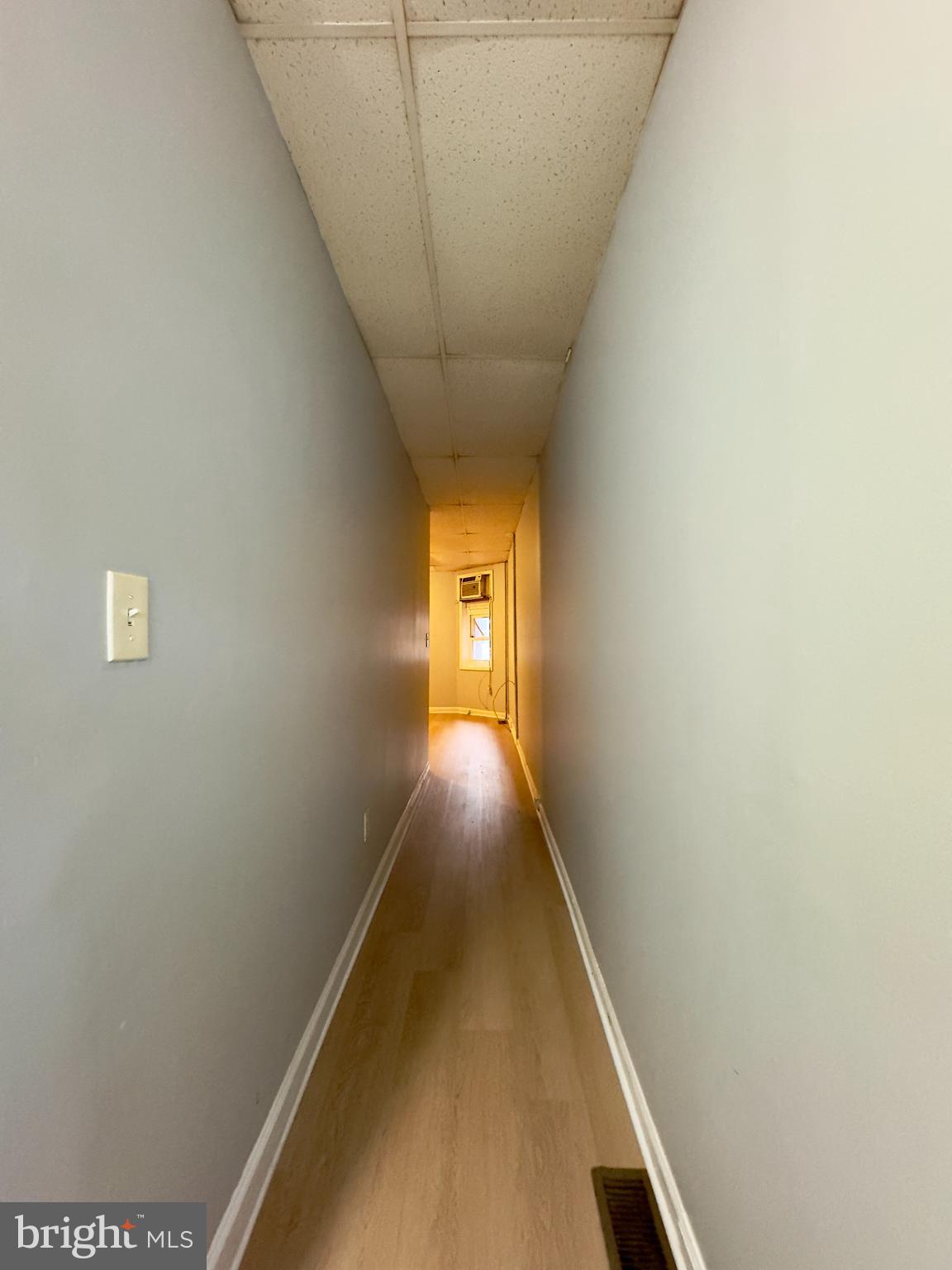 408 South Conkling Street, Unit 1 Baltimore, MD 21224 - Photo 4 of 14 a view of a hallway with wooden floor