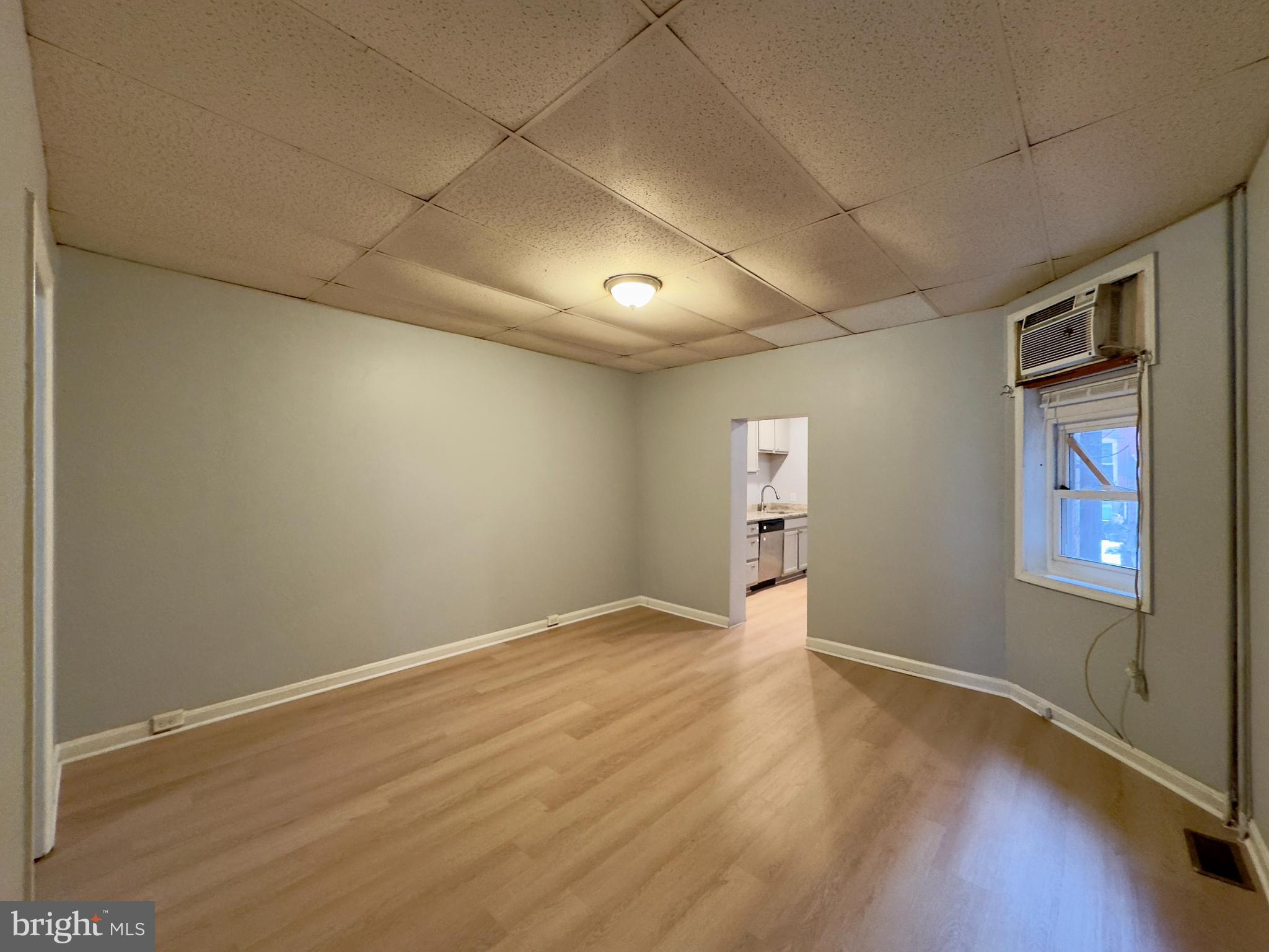 408 South Conkling Street, Unit 1 Baltimore, MD 21224 - Photo 5 of 14 an empty room with windows and closet