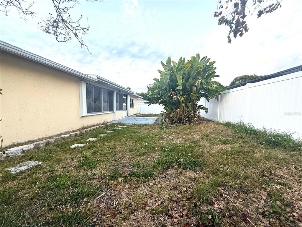 8840 Martinique Lane Port Richey, FL 34668 - Photo 31 of 31 a view of a house with a yard