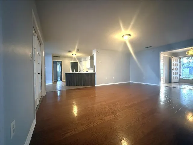 a view of a kitchen with a sink and a window
