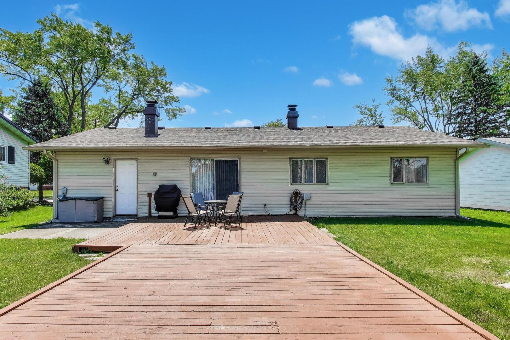 420 Bode Road Hoffman Estates, IL 60169 - Photo 17 of 20 a view of a house with sitting area and garden