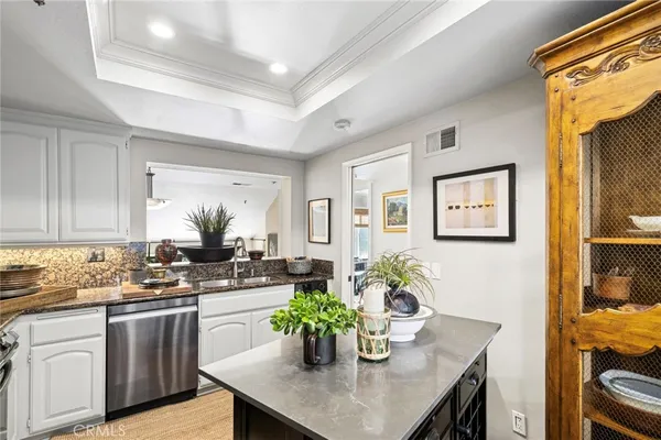 a kitchen with a table and chairs in it