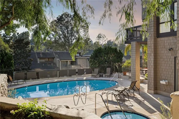 a view of a swimming pool with a patio