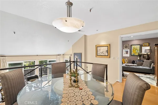 a living room with furniture a rug and a chandelier