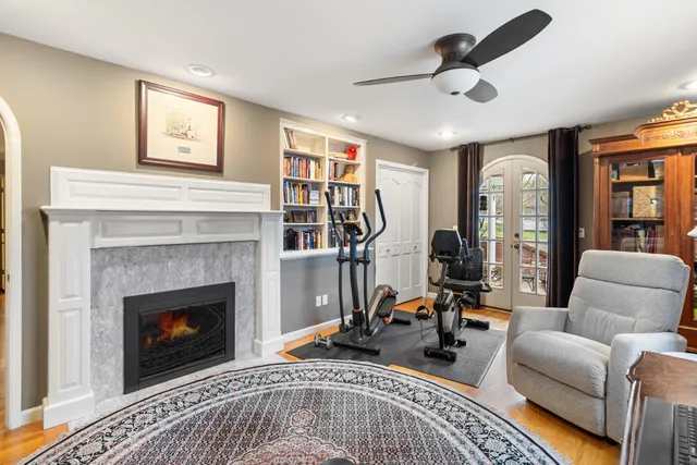 a bathroom with a sink double vanity granite tub and a mirror