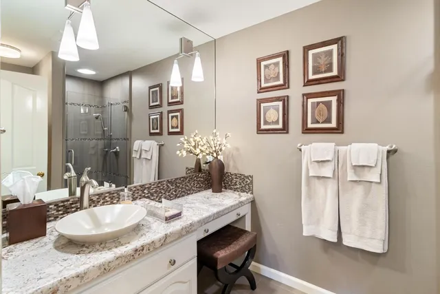 a bedroom with bed and a large window