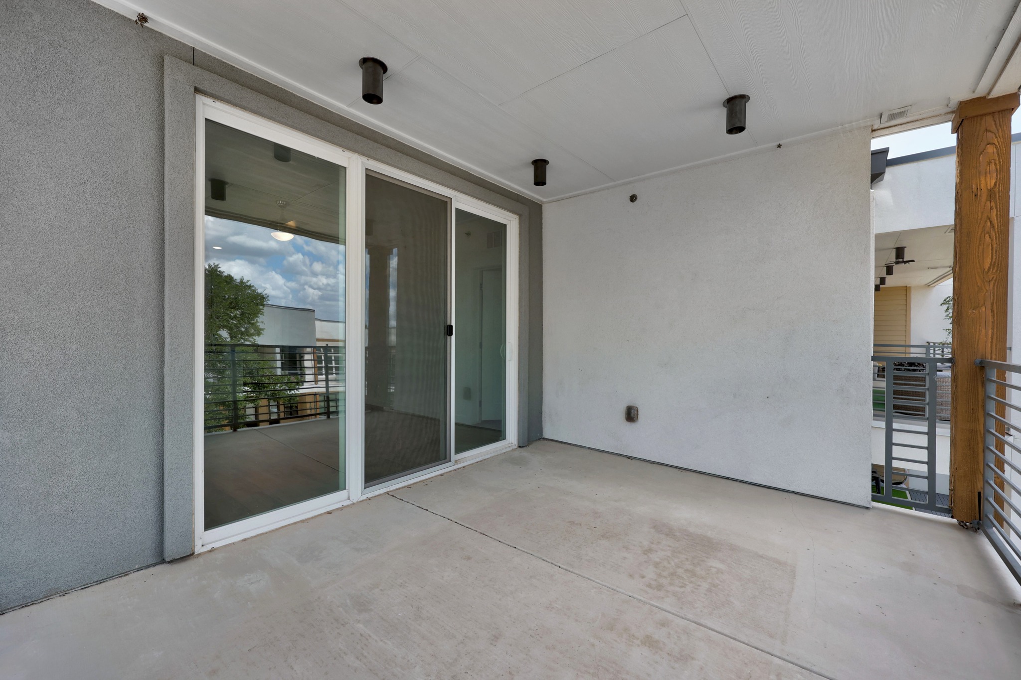 4801 Springdale Road, Unit 2301 Austin, TX 78723 - Photo 24 of 36 A private outdoor patio with durable concrete flooring offers ample space for relaxation.