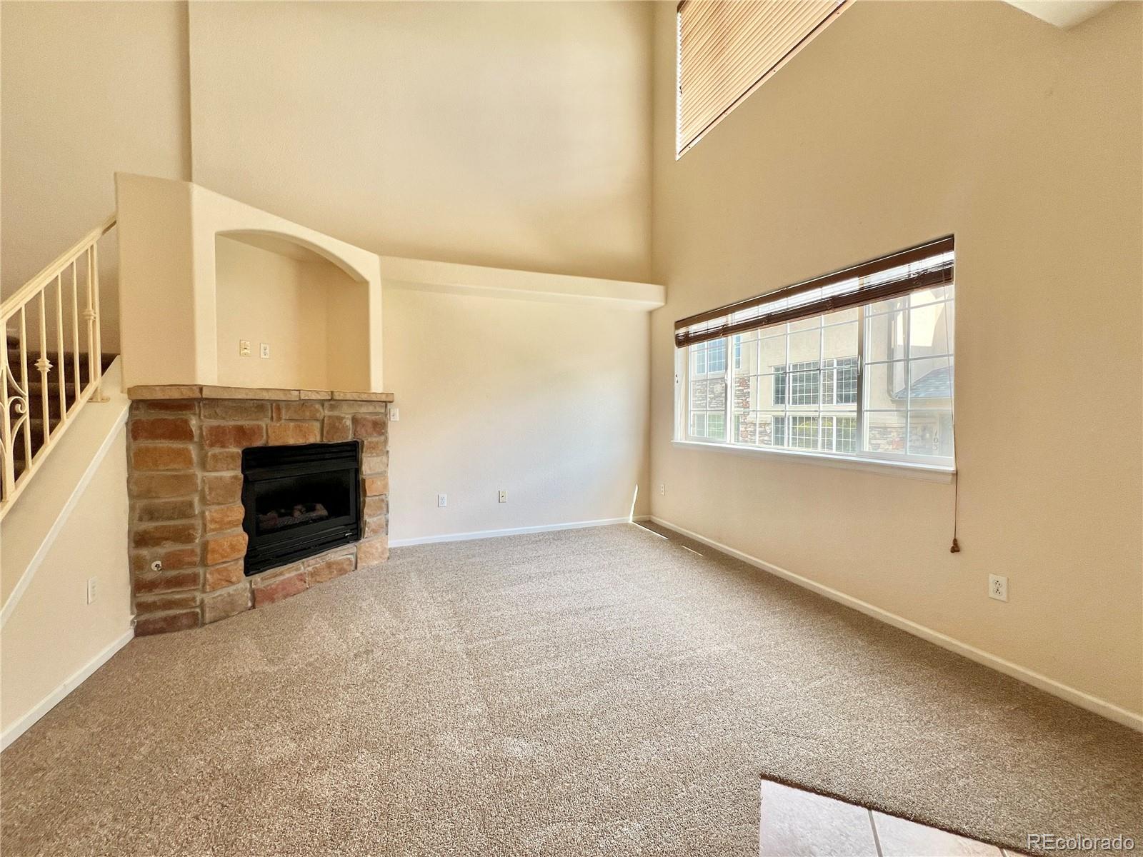 1385 South Chambers Road, Unit 102 Aurora, CO 80017 - Photo 7 of 20 an empty room with windows