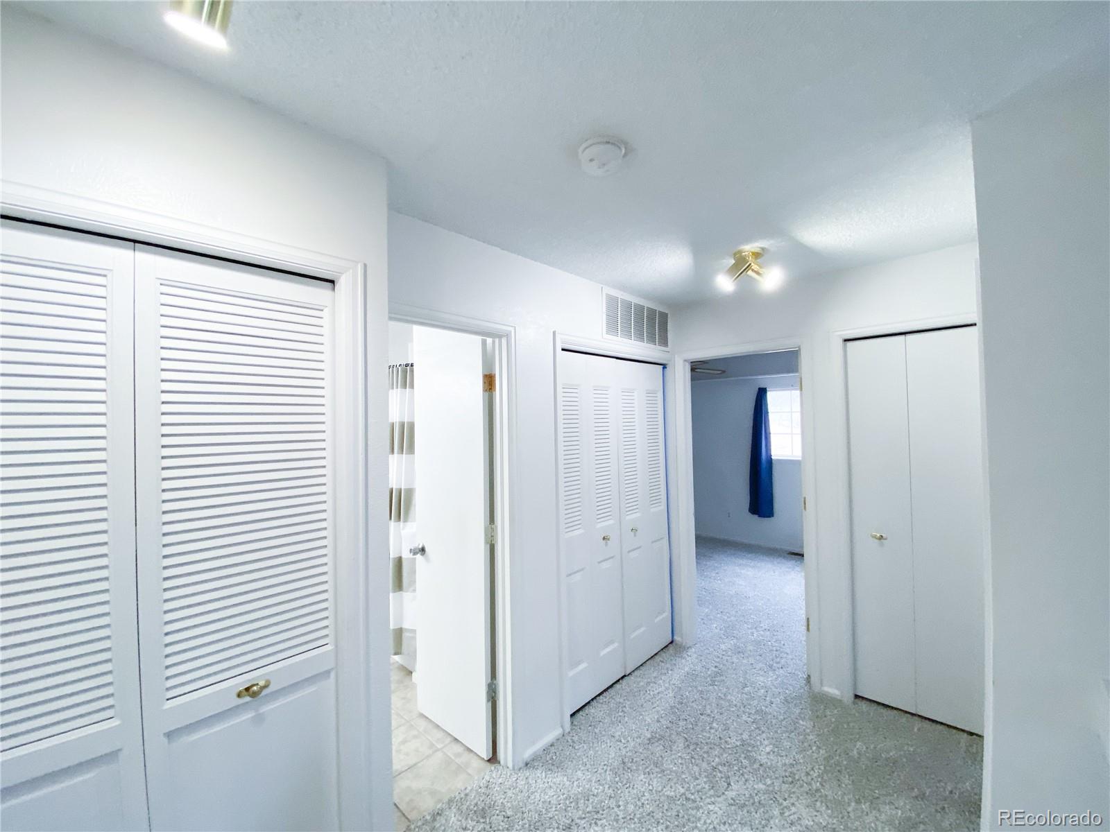 8423 Everett Way, Unit B Arvada, CO 80005 - Photo 17 of 27 a view of a hallway with closet area