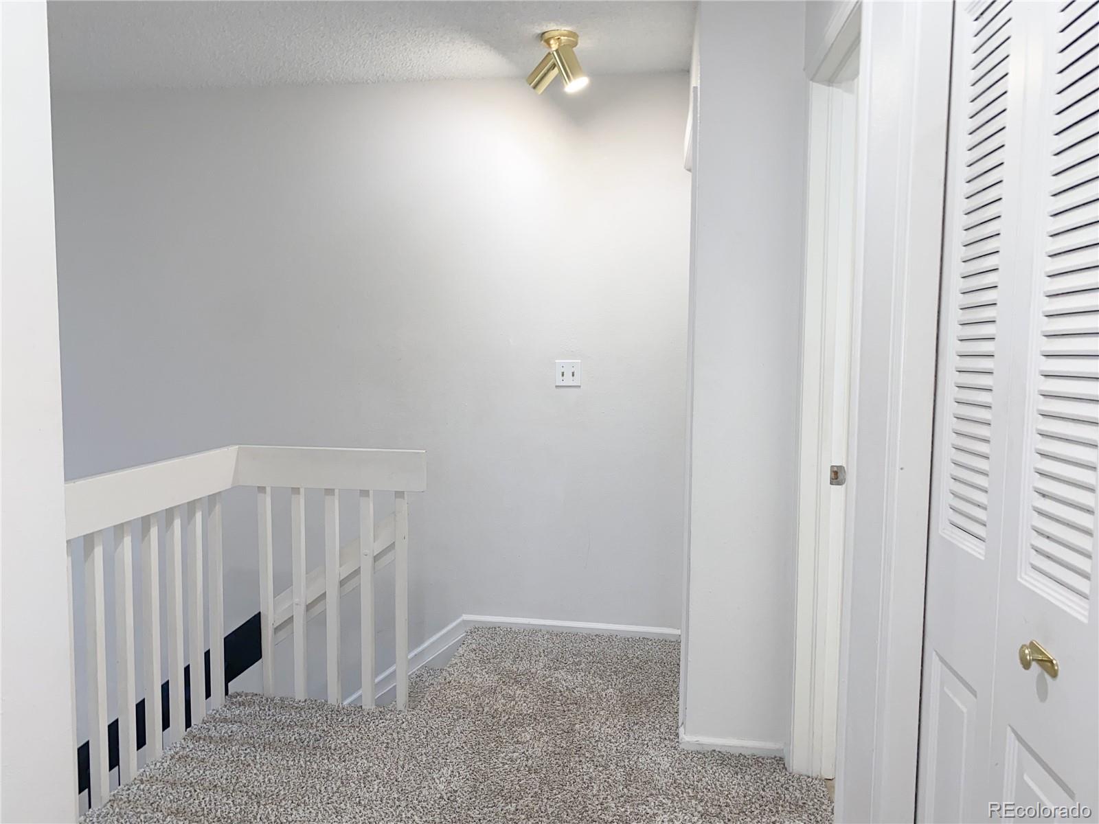 8423 Everett Way, Unit B Arvada, CO 80005 - Photo 24 of 27 a view of an entryway with staircase
