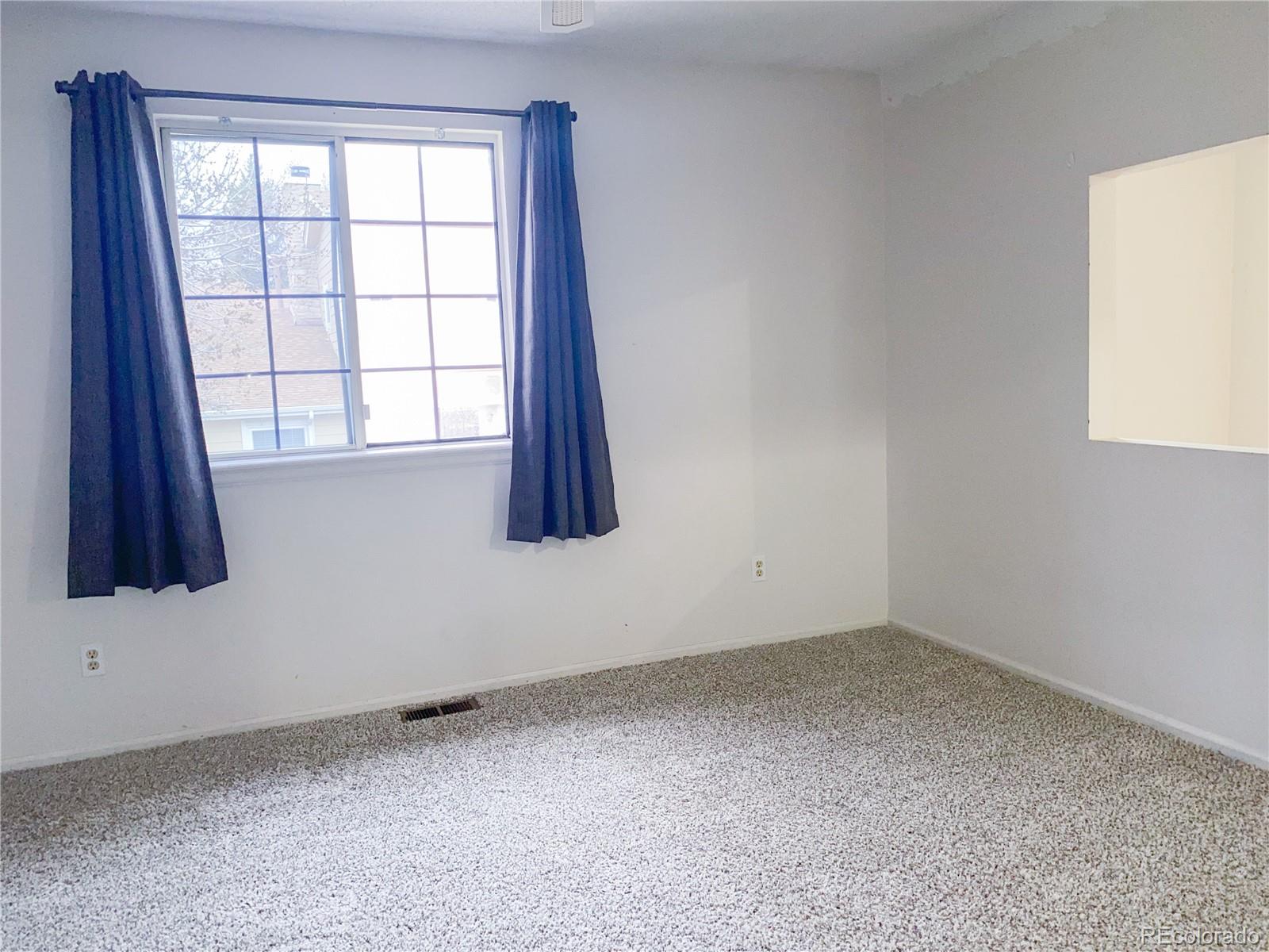 8423 Everett Way, Unit B Arvada, CO 80005 - Photo 26 of 27 an empty room with a window